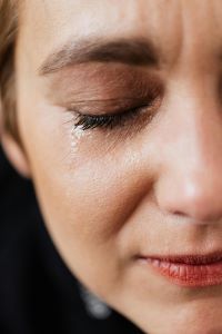 woman with a tear running down her face