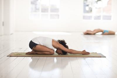 yoga exercise on a floor mat